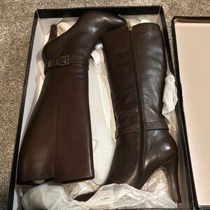 Dark brown med/high heel leather boots by Banana Republic. Never worn.